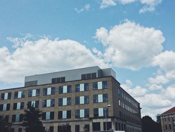 Low angle view of office building against sky