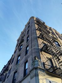 Low angle view of building against blue sky