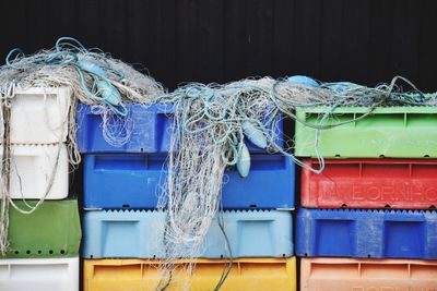 Buoys and fishing nets on colorful crates