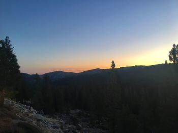 Scenic view of silhouette mountains against clear sky