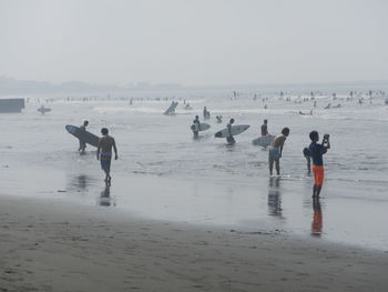 People enjoying at beach