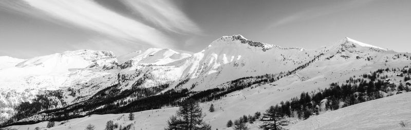 Scenic view of snowcapped mountains against sky