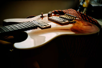 Close-up of guitar on table
