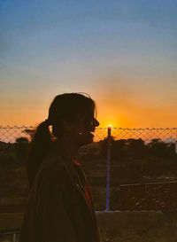 Portrait of girl looking at sunset