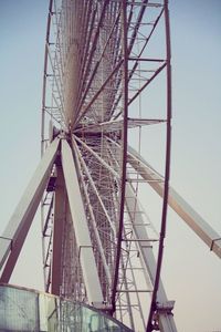 Low angle view of ferris wheel against sky