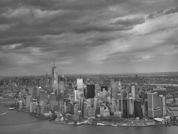 City skyline against cloudy sky