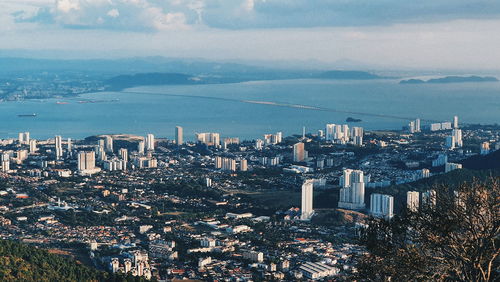 High angle view of city and buildings against sky