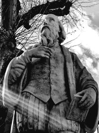 Low angle view of statue against trees