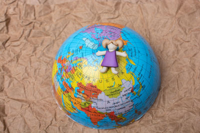 Close-up of multi colored ball against blue background