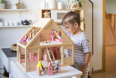 Portrait of boy playing with toy blocks