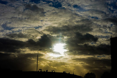 Low angle view of dramatic sky during sunset