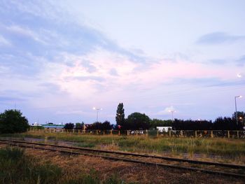 Train on railroad track against sky