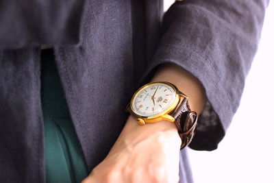 Close-up of women wearing wristwatch