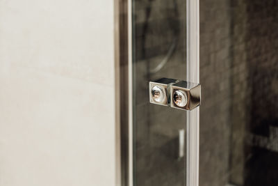 Close-up of camera on mirror against wall