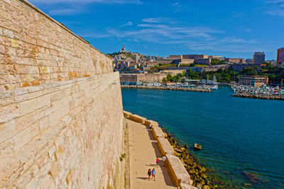 Panoramic view of buildings against blue sky