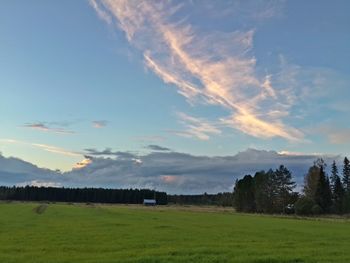 Scenic view of landscape against cloudy sky