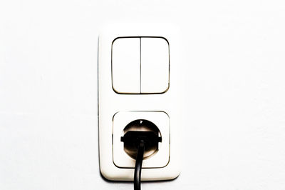 Close-up of electric lamp against white background