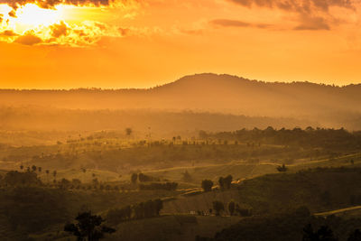 Scenic view of landscape against sky during sunset