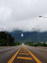 Empty road against sky