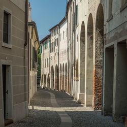 Narrow alley amidst buildings in city