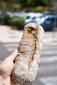 Close-up of hand holding ice cream