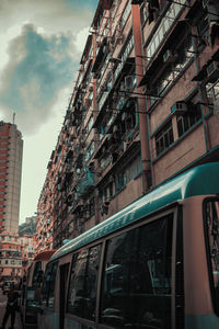 Low angle view of buildings in city against sky