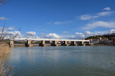 Built structures against blue sky and clouds