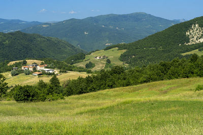 Scenic view of landscape and mountains against sky