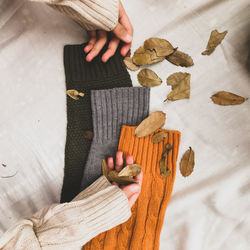 High angle view of woman hand on table