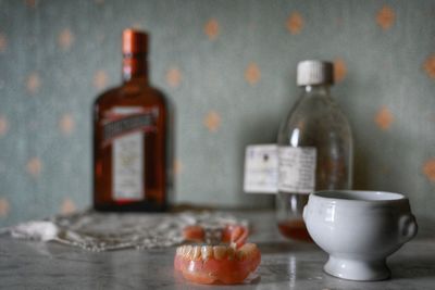 Close-up of wine bottles on table