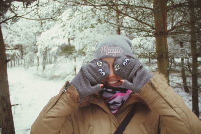 Portrait of young woman in snow