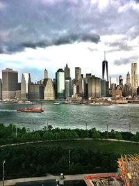 Cityscape against cloudy sky