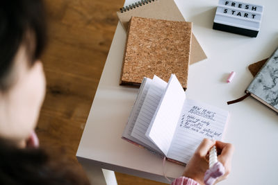 Midsection of woman using digital tablet