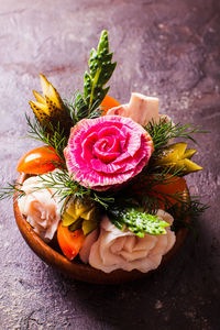 High angle view of roses in pot on table