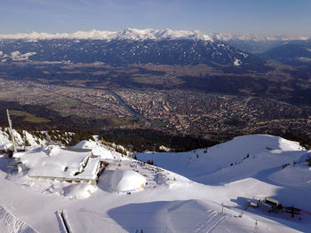 Aerial view of snowcapped mountains against sky