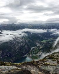 Scenic view of waterfall against sky