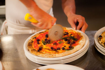 Midsection of man preparing food