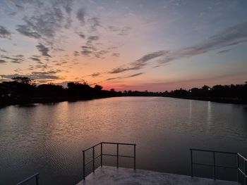 Scenic view of lake against sky during sunset