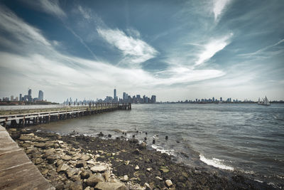 Panoramic view of river and buildings against sky