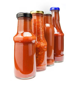 Close-up of drink in jar against white background