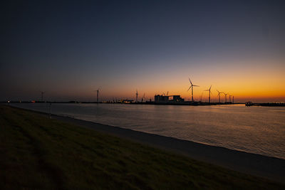 Scenic view of sea against clear sky during sunset