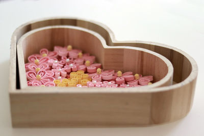 Close-up of pink flowers in bowl on table