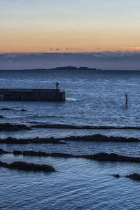 Scenic view of sea against sky during sunset