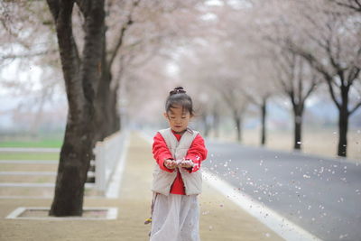 Portrait of girl with flower petals