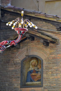 Low angle view of statue against building