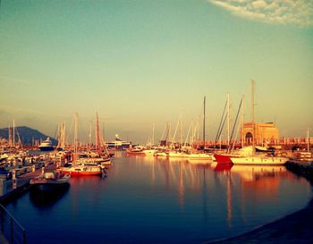 Boats moored at harbor