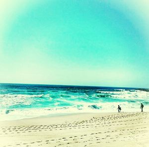 Scenic view of sea against blue sky