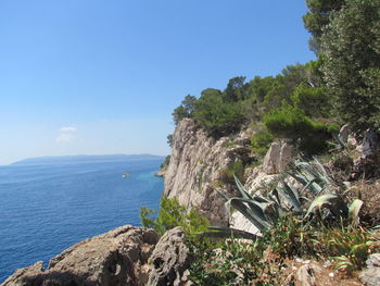 Scenic view of sea against clear blue sky