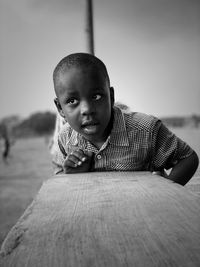 Portrait of boy on wood