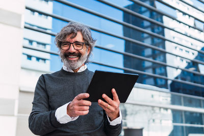 Portrait of man using mobile phone